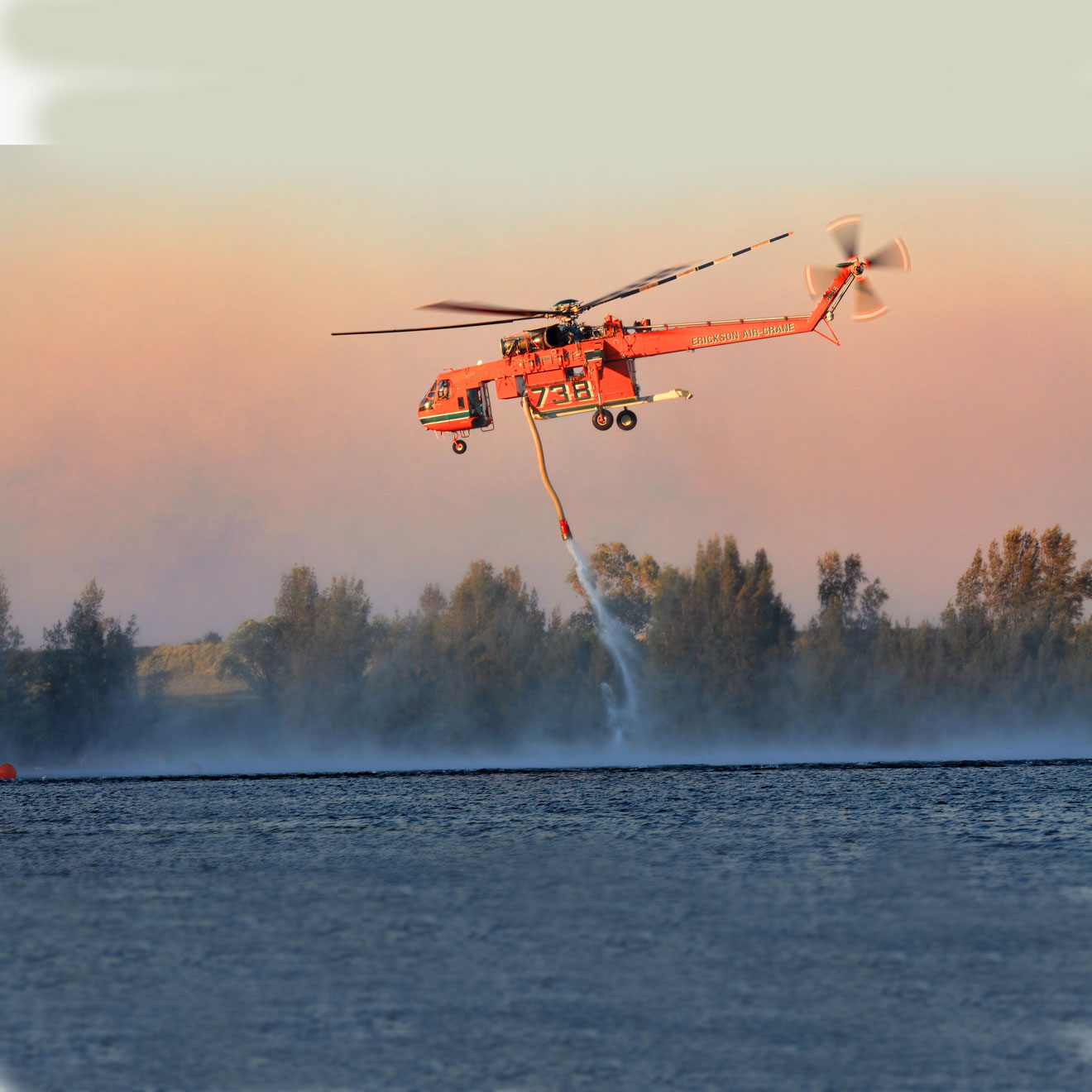 Firefighting helicoptor collecting water